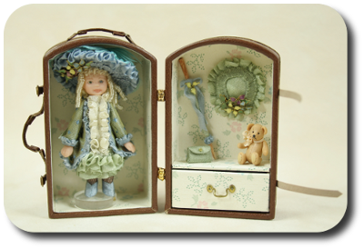 CDHM artisan Jennifer Matuszek creates handmade sculpted 1:12 dolls in dollhouse scale including porcelain dolls and character dolls