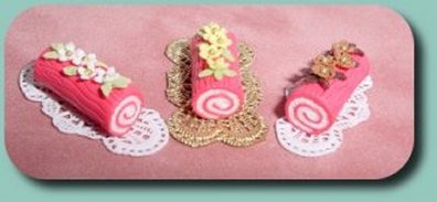 CDHM Artisan Nathalie Gireaud creates polymer clay dollhouse scale foods and dressed dolls and doll clothing in 1/12 scale