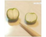 Scoring a natural line down the middle of the miniature dolls apples