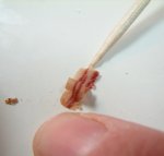 Arranging the dolls breakfast bacon using a toothpick