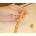 Remove any excess polymer clay from the broom handle of the spooky wizard broom