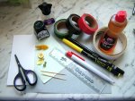 Tools and supplies needed to make a dolls house desk set with ink blotter and feather pen