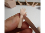 Creating detail on the wrist of the clay hands