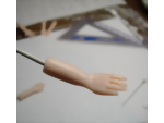 Cleaning up the final polymer clay sculpted hand