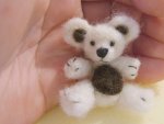 Completed needle felted miniature teddy bear