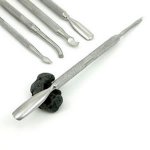 Using a pointed edge cuticle pusher for polymer clay sculpting