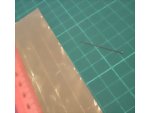Cutting and scoring the gold metallic paper into square pieces